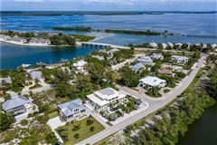 LOVELY NORTH SHORE HOME WITH GORGEOUS VIEWS OF LAKE GASPARILLA