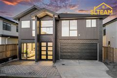 THIS MAGNIFICENT NEW HOME IS CAPTIVATING FROM THE MOMENT YOU STEP INSIDE