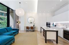 BEAUTIFULLY PRESENTED FLAT HAS GOOD OPEN PLAN SPACE AND A LARGE SOUTH FACING BALCONY