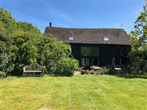 A FIVE-BEDROOM BARN CONVERSION WITH PLENTY OF CHARACTER AND DELIGHTFUL GARDENS
