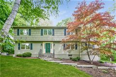 ENJOY WOODED PRIVACY WITH THIS LOVELY FAMILY HOME