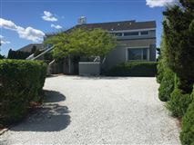 GREET BEACH AND OPEN SKIES IN CUSTOM BAY FRONT HOME