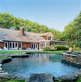 BEAUTIFULLY AND PRIVATELY SITED WATER MILL HOME
