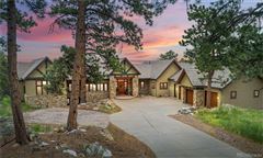EXPANSIVE CUSTOM STUCCO AND STONE HOME IN GENESEE PARK