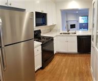 BEAUTIFULLY UPDATED, ONE LEVEL UNIT
