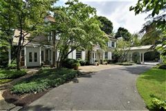 GRACIOUS WESTERN RESERVE STONE COLONIAL ON A BEAUTIFUL PARCEL OF LAND