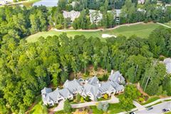 GRAND CUSTOM HOME IN SOUGHT-AFTER RIVER CLUB