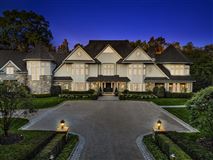 CHIC STONE AND CLAPBOARD HOME IN COVETED GATED COMMUNITY