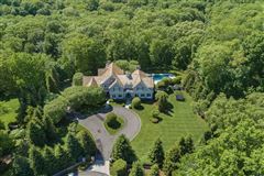 IMPECCABLE HOME ON TWO PRIVATE LANDSCAPED ACRES