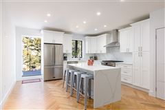 BEAUTIFULLY DESIGNED TWO FAMILY TOWNHOME