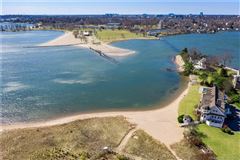CUSTOM HOME IN PRIVATE WATERFRONT SETTING