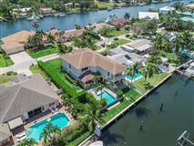 RECENTLY BUILT WATERFRONT HOME IN COVETED PIRATES COVE