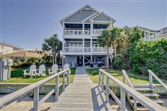 BEAUTIFULLY UPDATED WATERFRONT FLAT WITH UP TO A 50 FOOT BOAT SLIP ON BANKS CHANNEL