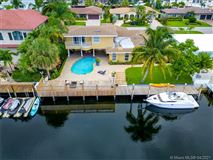REMARKABLE HOME IN DESIRABLE VENETIAN ISLES