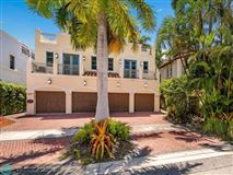 LUXURIOUS TRI-LEVEL WATERFRONT TOWNHOME WITH DEEDED DOCK