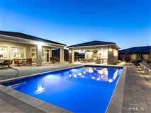 THIS IMMACULATE, SPACIOUS AND STYLISH RESIDENCE IS SET AT THE END OF A QUIET CUL-DE-SAC