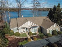 CUSTOM DESIGNED HOME IN PEACEFUL SETTING