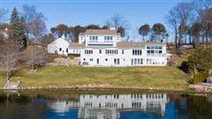 THIS SPECTACULAR UPDATED LAKE HOME HAS OVER 230 FEET OF PRISTINE FRONTAGE