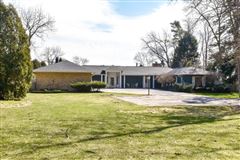ENJOY SPECTACULAR LAKE VIEWS FROM THIS EXTRAORDINARY RESIDENCE