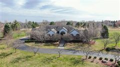 UNIQUE AND STYLISH HOME ON A WONDERFUL, PRIVATE THREE PLUS ACRES