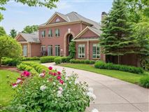 STRIKINGLY ELEGANT ALL BRICK TWO STORY HOME
