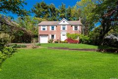 SADDLE ROCK ESTATES BRICK CENTER HALL COLONIAL