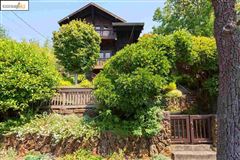 FIVE BEDROOM SWISS CHALET-STYLE HOUSE