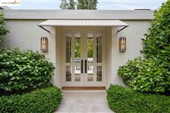 THIS CHIC HOME OFFERS AN EASY FLOOR PLAN AND DRAMATIC SPACES