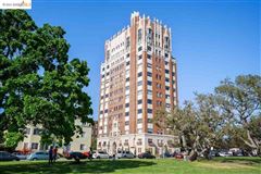 GRACIOUS LIVING IN THIS ELEGANT CONDO WITH SWEEPING VIEWS OF THE BAY AREA AND THE LAKE