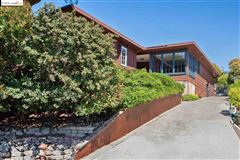 ELEGANT HOME SURROUNDED BY LOVELY GARDEN AND MULTIPLE DECKS