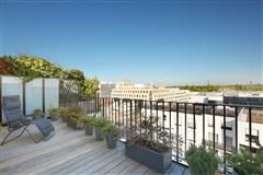 THIS SPLIT LEVEL APARTMENT WITH TERRACE ENJOYS AN OPEN VIEW OF PARIS AND THE EIFFEL TOWER