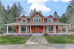 ONE-OF-A-KIND CRAFTSMAN HOME ON FIVE-PLUS ACRES