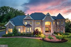ELEGANT CUSTOM BRICK HOME ON LUSH PROPERTY