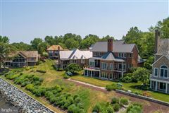 SHOW STOPPING UNOBSTRUCTED SOUTH RIVER VIEWS IN THIS IMMACULATE HOME