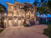 PRIVATELY SITUATED CUSTOM GULF-ACCESS HOME