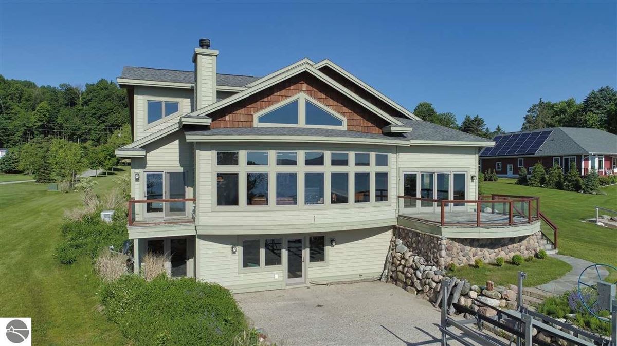 NO DETAIL OVERLOOKED IN THIS STUNNING HOME ON TORCH LAKE Michigan