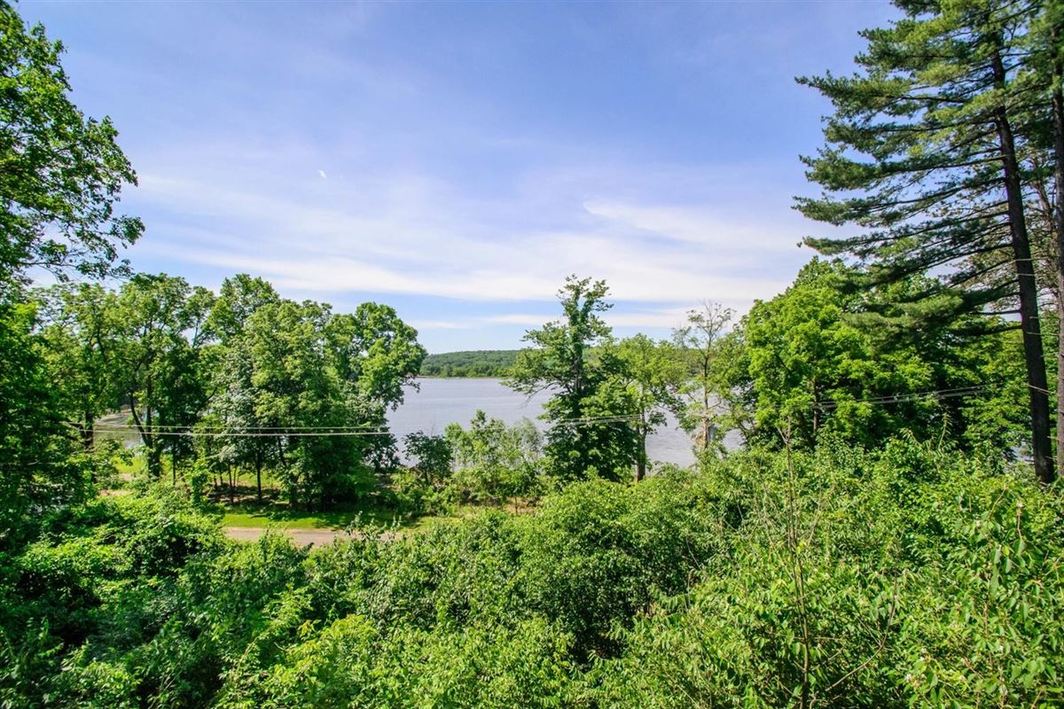 HILLSIDE SETTING IN THE VILLAGE OF BARTON HILLS Michigan Luxury Homes Mansions For Sale