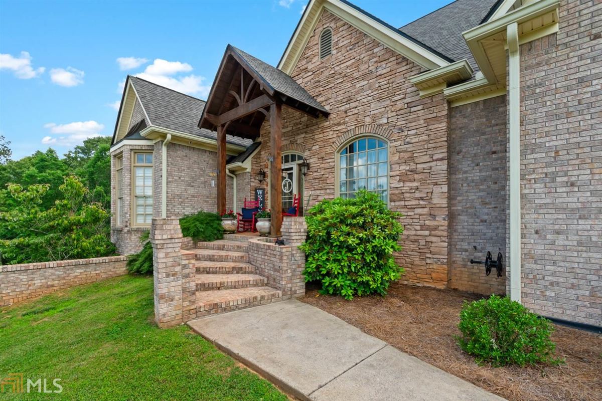 CUSTOM BRICK RANCH HOME WITH EXQUISITE FINISHES Luxury Homes