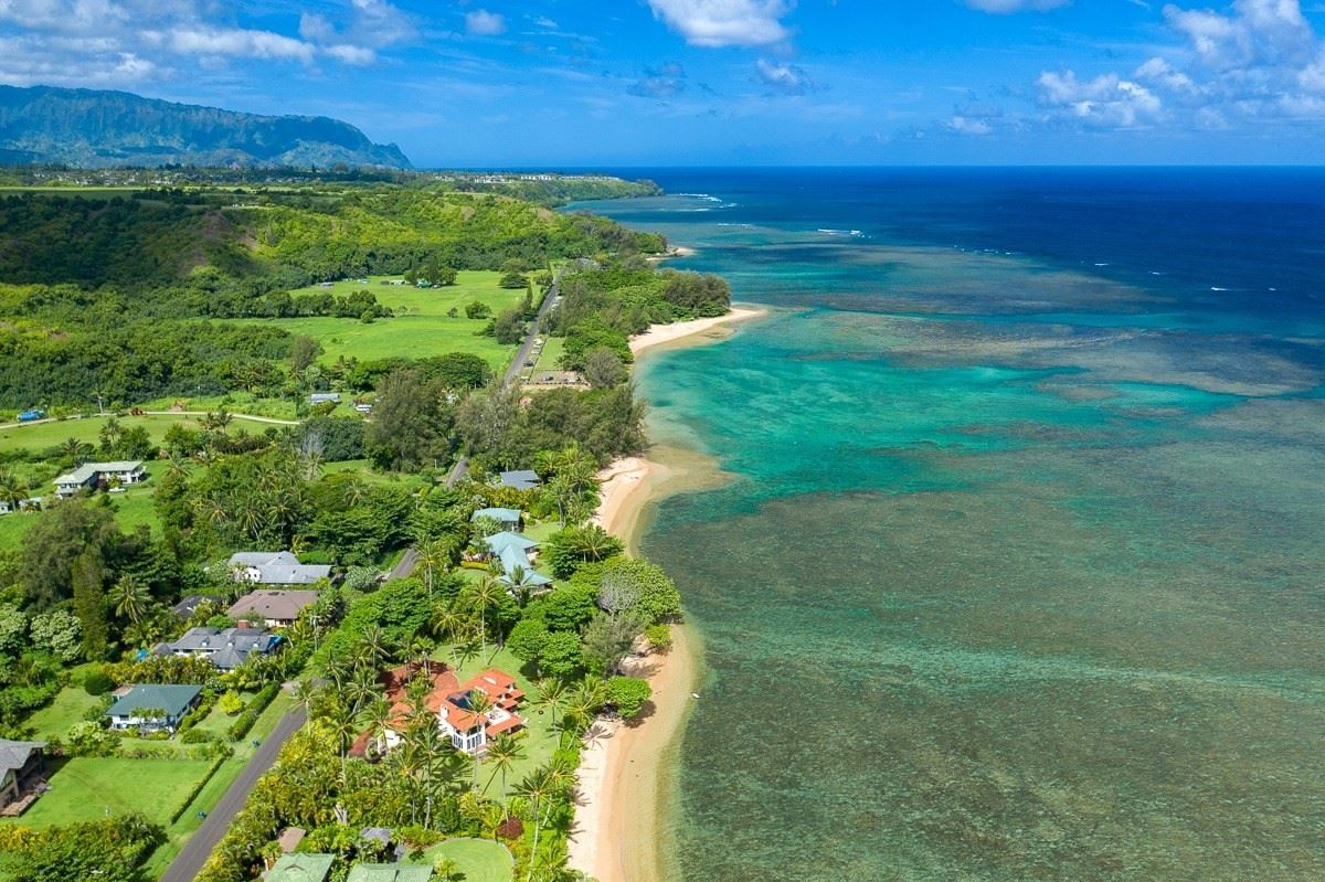 FROM THIS INCREDIBLE BEACHFRONT ESTATE, ROLL OUT ONTO THE PRISTINE